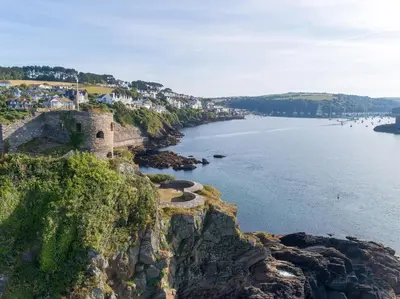an old castle on a cliff next to the water at 3 Bed in Fowey oc-82101 in Fowey