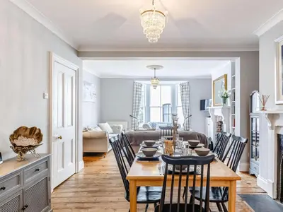 a kitchen and living room with a table and chairs at 3 Bed in Fowey oc-82101 in Fowey
