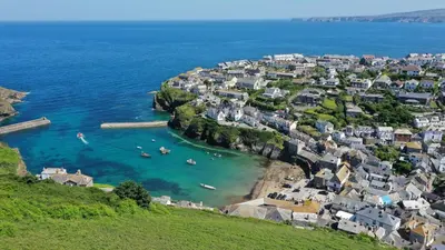 an aerial view of a village with boats in the water at Homestead in Port Isaac