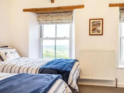 a bedroom with two beds and a window at 2 Bed in Fowey oc-86873 in Saint Veep