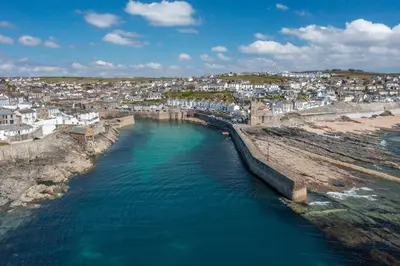 an aerial view of a river in a city at Porthleven B and B in Helston