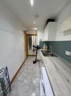 a kitchen being remodeled with a counter and a sink at Caledonian House - Newquay in Newquay