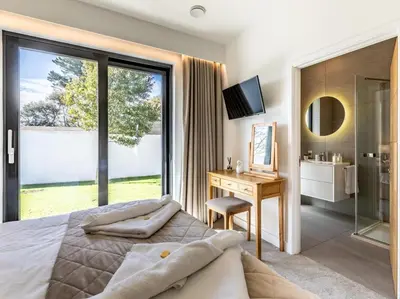 a bedroom with a bed and a desk and a window at 3 Bed in South Tehidy oc-90549 in Camborne