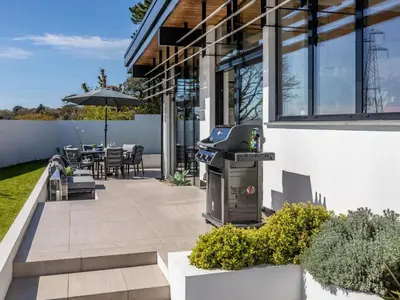 a backyard with a barbecue grill on a patio at 3 Bed in South Tehidy oc-90549 in Camborne