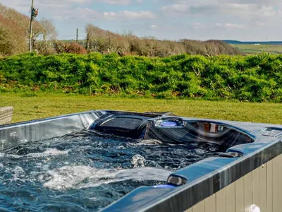 a bath tub filled with water in a field at 1 Bed in Camelford oc-90818 in Camelford