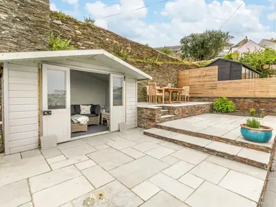 a patio with a house and a building at 2 Bed in Fowey oc-91396 in Fowey