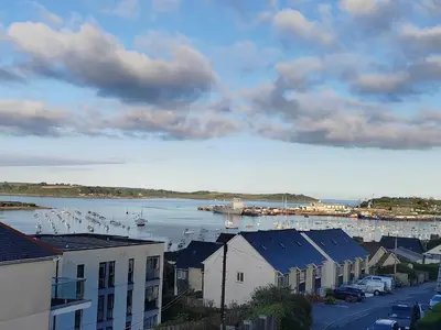 a view of a harbor with boats in the water at Modern open plan house, sea views and hot tub in Falmouth