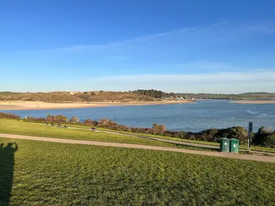 a view of a body of water with a beach at Padstow Lodge in Padstow