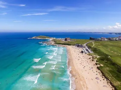 an aerial view of a beach and the ocean at Bredon Court overlooking Fistral beach, Newquay in Newquay