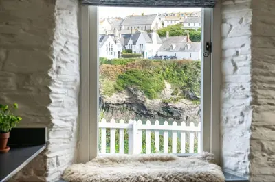 a window with a view of a white fence at White House, Port Isaac Bay Holidays in Port Isaac