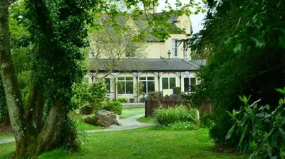 a house with a garden in front of it at 12 Tudor Court, Tolroy Manor in Hayle