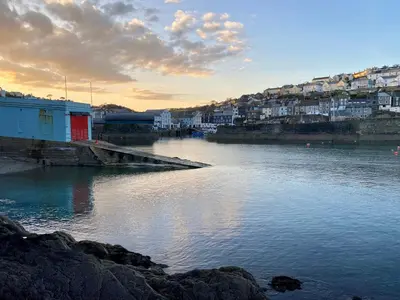 a view of a body of water with buildings and houses at About Time Meva - stylish two-bedroom, dog-friendly home-from-home with parking and garden in Mevagissey