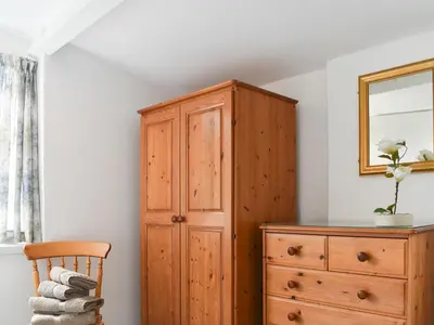 a wooden cabinet and a dresser in a room at Madderhay - Uk43512 in Lostwithiel