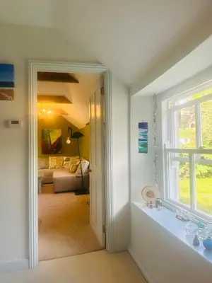 a room with a bathroom and a living room at Exceptional retreat near Cornwall Coast in Tywardreath