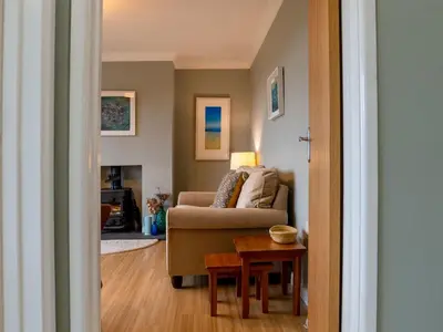 a living room with a couch and a table at Holiday Home Valley View by Interhome in Mevagissey