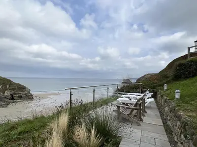 a row of picnic tables on the beach at UPPER BEACH HOUSE in Portreath