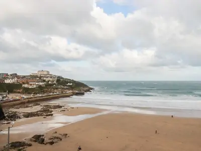 a view of a beach with a town and the ocean at Towan Penthouse in Newquay