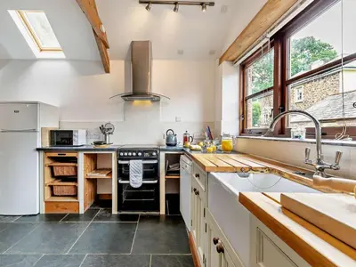 a kitchen with a sink and a stove at 2 Bed in Launceston oc-02043 in North Petherwin