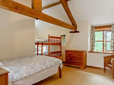 a bedroom with a bed and a dresser in a room at 2 Bed in Launceston oc-02036 in North Petherwin