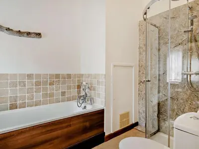 a bathroom with a shower and a tub and a toilet at 2 Bed in Launceston oc-02036 in North Petherwin