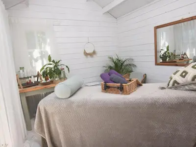 a bedroom with a bed with a mirror and plants at 2 Bed in Callington oc-kates in North Hill
