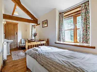 a bedroom with a bed and a window at 2 Bed in Launceston oc-02038 in North Petherwin