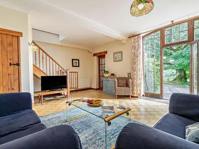 a living room with a couch and a glass table at 2 Bed in Launceston oc-02038 in North Petherwin