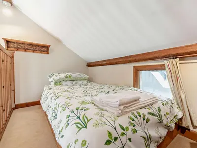 a bedroom with a bed and a window at 2 Bed in Launceston oc-02033 in North Petherwin
