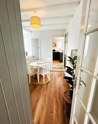 a room with a table and a dining room at Cosy cottage near the coast in Tywardreath