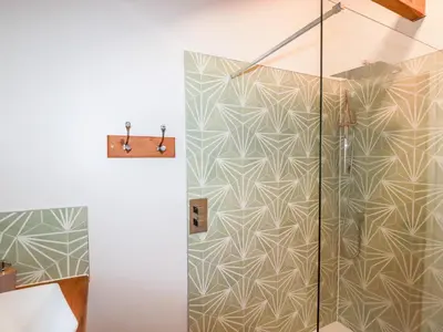 a shower in a bathroom with a glass door at The Old Cattle Barn in Launceston