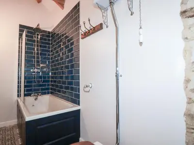 a bathroom with a sink and a shower at The Old Cattle Barn in Launceston