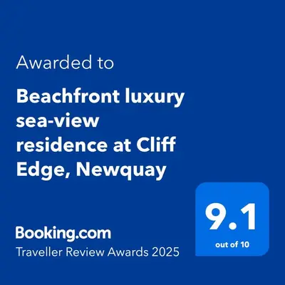 a screenshot of a phone with the text upgraded to waterfront luxury sea view residence at at Quiet Clifftop luxury apartment with partial seaviews in Newquay