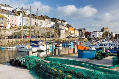 a group of boats are docked in a harbor at Finest Retreats - Porthole Cottage in Mevagissey