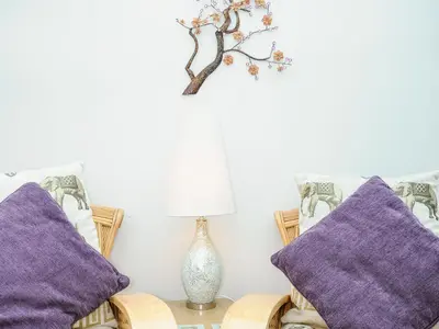 a room with two purple pillows and a lamp at St Albans in Boscastle