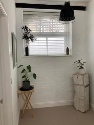 a room with a window and a table with plants at Private Double Room with Ensuite, No Breakfast, Truro City Centre in Truro