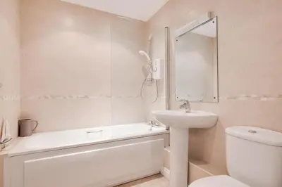 a bathroom with a sink and a toilet and a bath tub at 2 Bed in Wadebridge oc-p00374 in Wadebridge