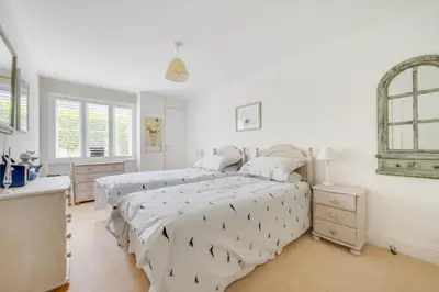 two beds in a bedroom with white walls at 2 Bed in Wadebridge oc-p00374 in Wadebridge