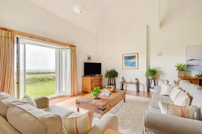a living room with a couch and a tv at 2 Bed in Wadebridge oc-p00374 in Wadebridge