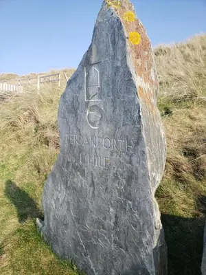 a rock with the words bergdorffulumulumulumulumulumulum at Sea Break, Perran Sands, Perranporth in Perranporth