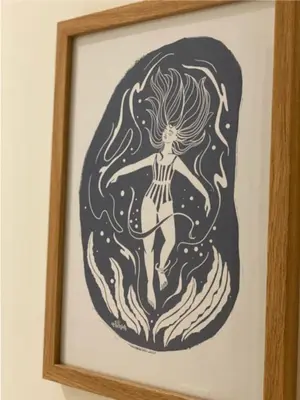 a picture of a mermaid in a picture frame at Sunny Eco Home minutes from the beach (Tamsin) in Newquay