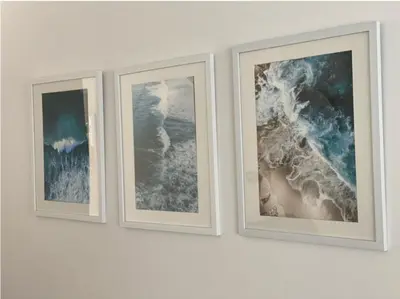 three framed photographs on a white wall at Sunny Eco Home minutes from the beach (Tamsin) in Newquay
