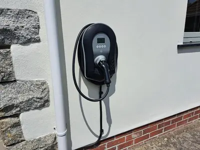 a pay phone attached to the side of a building at Trevallion in Saint Endellion