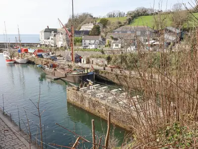 a group of boats docked in a harbor at Eden Retreat in Par