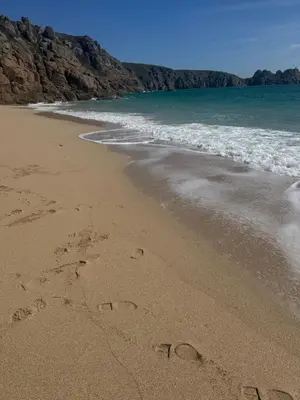 hearts drawn in the sand on the beach at Holywell Lodge in Newquay