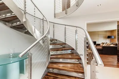 a metal staircase in a house with a living room at Moonfleet in Saint Mawes
