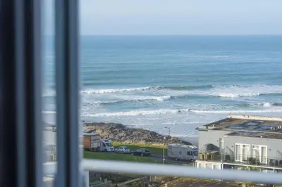 a view of the ocean from a window at The Penthouse Forty Eight, Ocean 1 in Newquay
