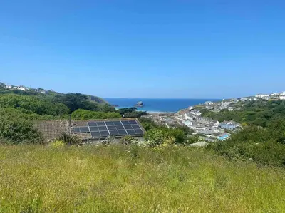 a group of solar panels on top of a hill at Cliffside 3 Bedroom House with Sea Views in Portreath