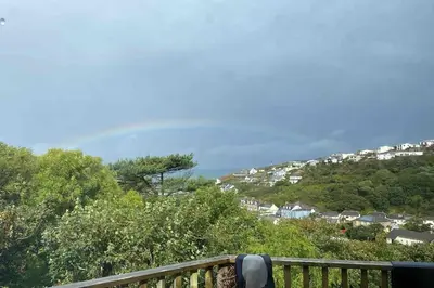 a view of a town on a hill with houses at Cliffside 3 Bedroom House with Sea Views in Portreath