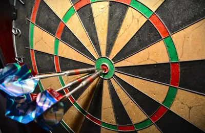a close up of a dart board with darts at 3 Bed in Little Petherick oc-balcot in Little Petherick