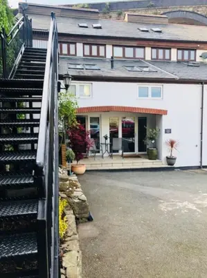 a building with a staircase in front of it at The Old Smelting Works in Truro